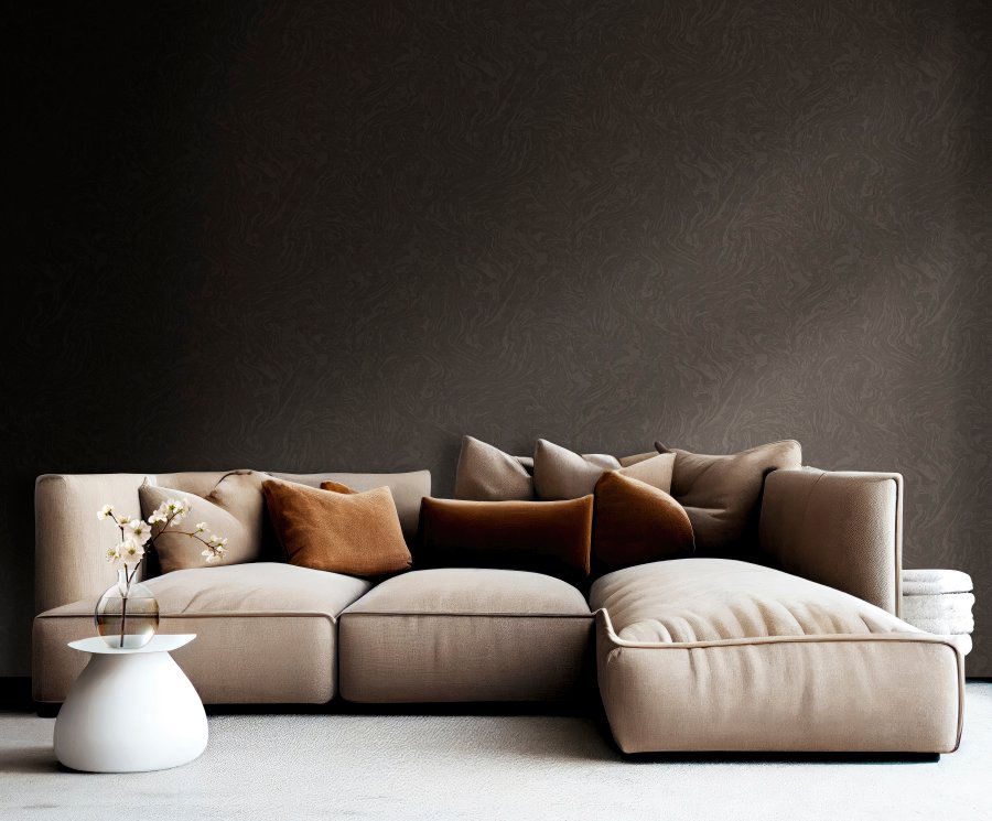 Light brown sofa with beige carpet in apartment on grey wall background